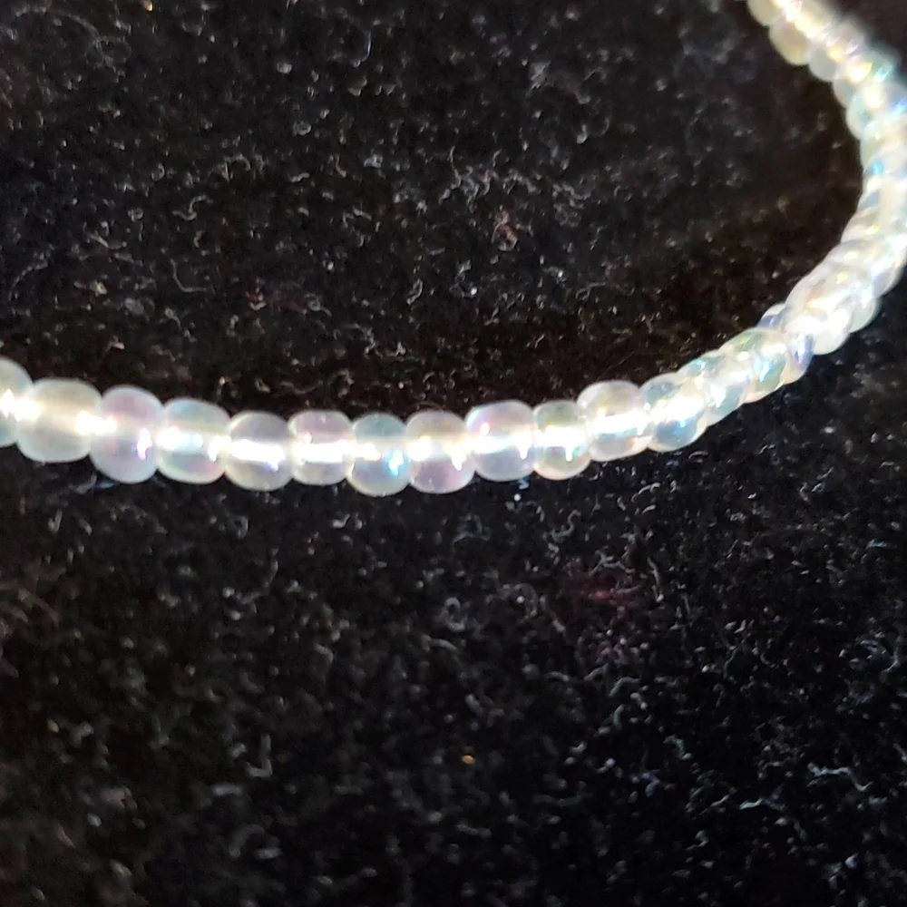 Clear iridescent beaded stretch necklace 14 inches long unstretched